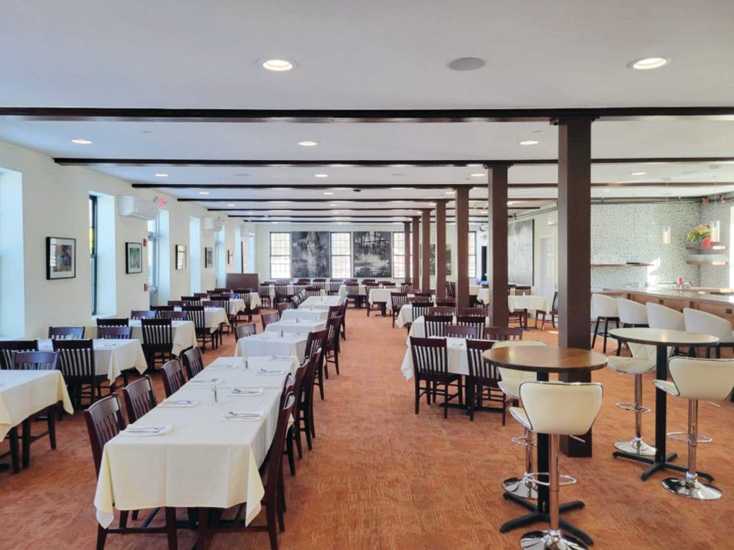 The spacious dining room at Sharks is bright and inviting.